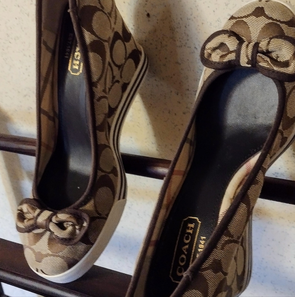 Coach brand women's wedge heel that has the classic Coach pattern